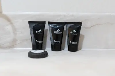 two pairs of black boots sitting on a shelf at Ahlan HH - Princess Tower - Elegant 1BR in Dubai Marina in Dubai