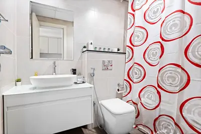 a bathroom with a white toilet and a sink at StoneTree - Modern Studio - Carson A in Dubai