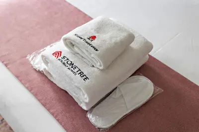 a pair of towels sitting on top of a table at Cozy Studio in Al Furjan in Dubai