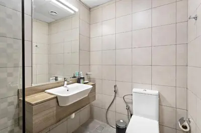 a bathroom with a sink and a toilet at Cozy Studio in Al Furjan in Dubai