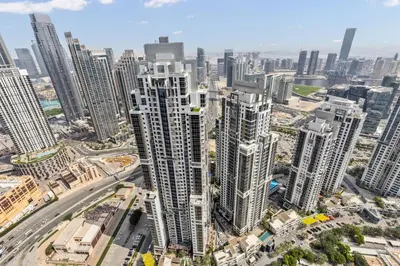 an aerial view of a city with tall buildings at High Floor Burj Khalifa & Sea View with stunning Infinity Pool in Dubai