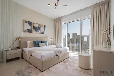 a bedroom with a large bed and a large window at Elegant 2BR Apartment in La Vie, JBR by Deluxe Holiday Homes in Dubai