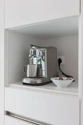a coffee maker sitting on top of a shelf at Fabulous 1BR apartment in Address Beach Resort in Dubai