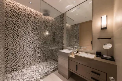 a bathroom with a shower and a sink and a mirror at Fabulous 1BR apartment in Address Beach Resort in Dubai