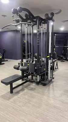 a gym with a bunch of equipment in a room at Newly renovated cosy studio in Dubai