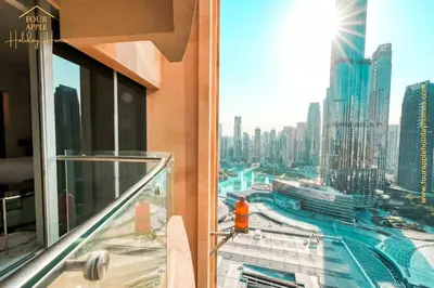 a view of a city from the balcony of a building at EMAAR Residences Fashion Avenue Full Burj Khalifa views Studio in Dubai