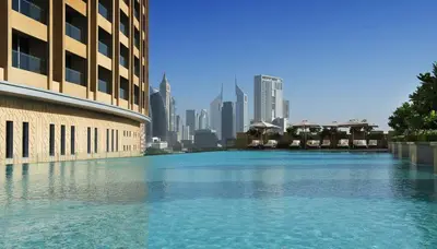 a large body of water in front of a city at EMAAR Residences Fashion Avenue Full Burj Khalifa views Studio in Dubai