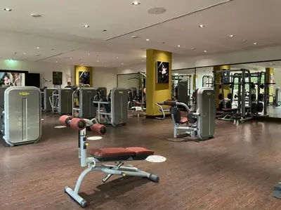 a gym with a lot of equipment in a room at FIRST CLASS 1BR in Royale Apartment on the Palm in Dubai