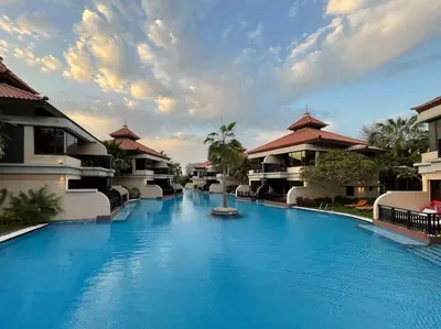 a large blue swimming pool next to some buildings at FIRST CLASS 1BR in Royale Apartment on the Palm in Dubai