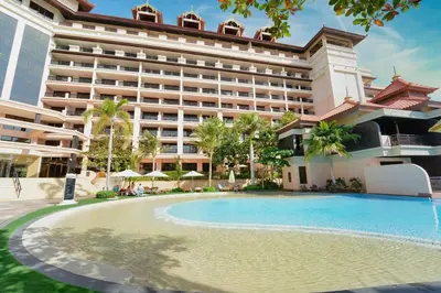 a hotel with a swimming pool in front of a building at FIRST CLASS 1BR in Royale Apartment on the Palm in Dubai