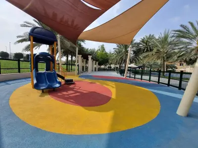 a playground at a park with a slide at YALLA REMRAAM in Dubai