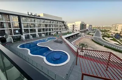 a large building with a swimming pool on the top of it at Magnificent studio-One of kind in Dubai in Dubai