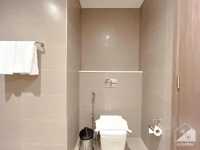 a bathroom with a toilet and a shower at Spacious 3.5 Bedroom Apartment in Burj Royale in Dubai