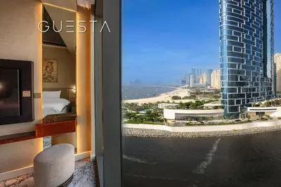a hotel room with a view of the ocean at 52 I 42 Tower by Emaar, Dubai Marina in Dubai