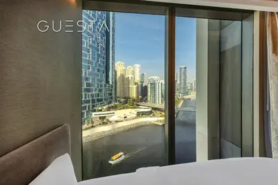 a bedroom with a window with a view of the city at 52 I 42 Tower by Emaar, Dubai Marina in Dubai
