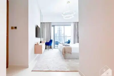 a hotel room with a bed and a window at Luxury Burj Royale 4Bed Balcony Burj Khalifa View in Dubai