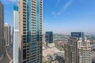 an aerial view of a city with tall buildings at Stylish 1 BR in Dubai Marina in Dubai