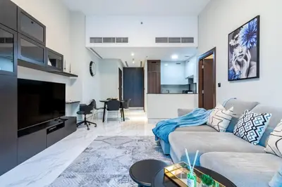 a living room with a couch and a tv at Jone brand-new aptm near Dubai Mall & Burj Khalifa in Dubai
