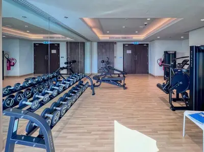 a gym with treadmills and elliptical machines at Jone brand-new aptm near Dubai Mall & Burj Khalifa in Dubai