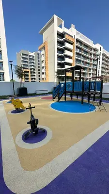 a park with a playground with a swing at Luxury Studio with big balcony Azizi Riviera Meydan in Dubai