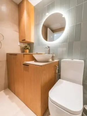 a bathroom with a toilet and a sink and a mirror at Cozy Chic Studio with Balcony The Greens Dubai in Dubai