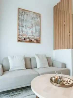 a living room with a couch and a coffee table at Cozy Chic Studio with Balcony The Greens Dubai in Dubai
