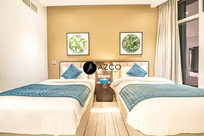two beds sitting next to each other in a bedroom at Panoramic 2BR - 3 Balconies & Canal Views - Damac Maison Prive by AZCO Holiday Homes in Dubai