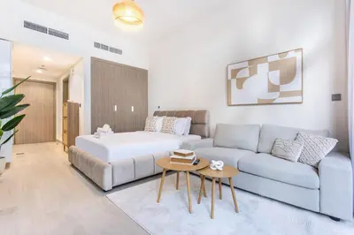 a living room with a bed and a couch at Artist Heaven Studio! Riviera 35! 10 min Downtown in Dubai