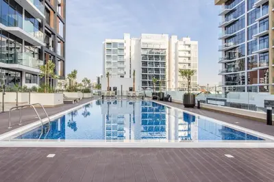 an image of a swimming pool in a building with buildings at Artist Heaven Studio! Riviera 35! 10 min Downtown in Dubai