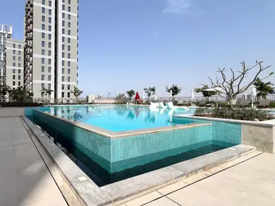 a swimming pool in the middle of a building at Frank Porter - Socio Tower 2 in Dubai