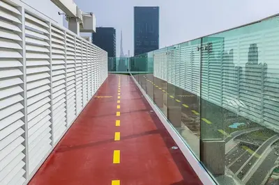 a view of a long hallway in a building at Frank Porter - 1 Residences in Dubai
