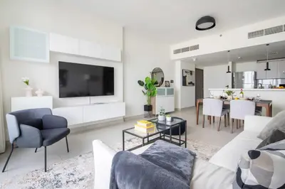 a living room with a couch and a table at Frank Porter - 1 Residences in Dubai