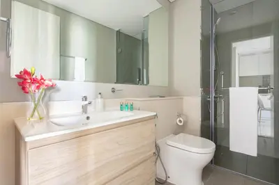 a bathroom with a sink and a toilet and a shower at Frank Porter - Zada Tower in Dubai