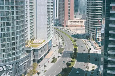 an aerial view of a street in a city with tall buildings at Panoramic LUX Apartment with Burj Khalifa View in Dubai