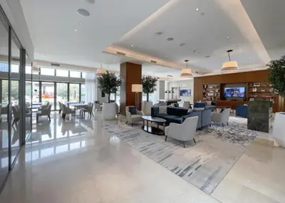 a lobby with a living room and dining room at Luxury 1BR The Address Opera, Downtown Dubai in Dubai