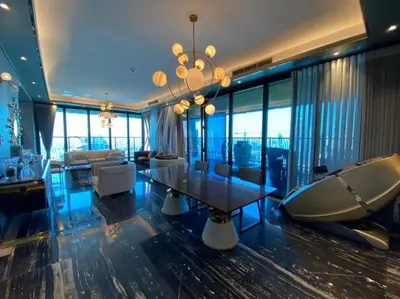 a large living room with a table and a couch at Luxurious 2BR in MBL JLT Brand New in Dubai