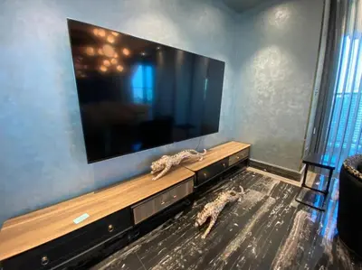 a living room with a large flat screen tv at Luxurious 2BR in MBL JLT Brand New in Dubai