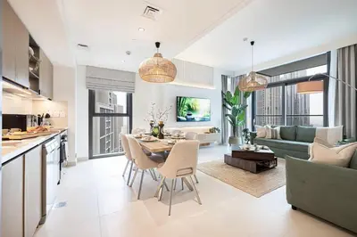 a kitchen and living room with a table and chairs at Burj Crown - New Sky High, Near Burj Khalifa, Boulevard View, Opposite Dubai Mall in Dubai