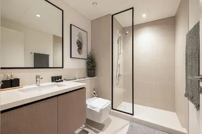 a bathroom with a toilet and a sink and a shower at Burj Crown - New Sky High, Near Burj Khalifa, Boulevard View, Opposite Dubai Mall in Dubai