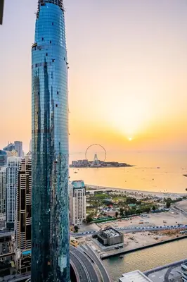 a view of a city with a tall skyscraper at VIBES by Beds and Company - 51st Floor, Full Sea View in Dubai