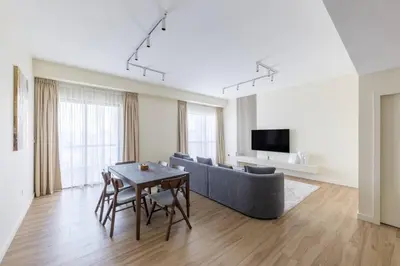 a living room with a couch and a table at Luxury Living on the Top Floor Full Marina View in Dubai