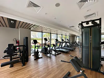 a gym with a bunch of treadmills and machines at ALiving Classy 1BR I Close to Dubai Mall I Zada Tower, Business Bay- 1617 in Dubai