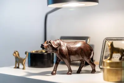 a figurine of a monkey on a table with a lamp at FIRST CLASS 1BR Tranquil Oasis in Old Town in Dubai