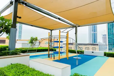 a playground in a building with a yellow canopy at Burj Crown - First Class Boulevard View, 9 min Walk Dubai Mall in Dubai