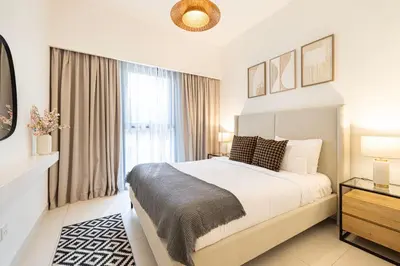 a bedroom with a large bed and a window at Burj Crown - First Class Boulevard View, 9 min Walk Dubai Mall in Dubai