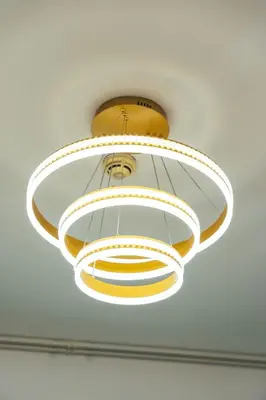 a ceiling light hanging from a ceiling at Luxury Studio, 29 Boulevard near Burj Khalifa Downtown - Chalet Homes in Dubai