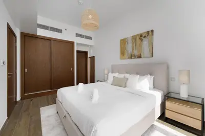 a bedroom with a large white bed in a room at Luxury Living resort style in Zaya Hameni in Dubai