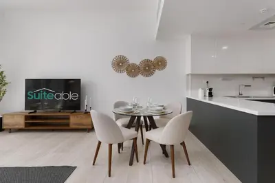 a kitchen and dining room with a table and chairs at Luxury Living resort style in Zaya Hameni in Dubai