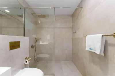 a bathroom with a shower and a toilet at Luxury Living resort style in Zaya Hameni in Dubai