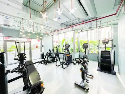 a gym with several exercise bikes and treadmills at MAG318, Modern Studio Apartment with Great Amenities and Canal View, 5min Walk to Dubai Mall in Dubai